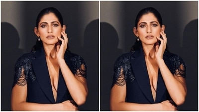 Kubbra looked stunning as ever in the midnight blue bespoke suit featuring dramatic sleeves embellished in silver resham threads. She teamed it with a matching pair of formal trousers. (Instagram/@kubbrasait) Kubbra looked stunning as ever in the midnight blue bespoke suit featuring dramatic sleeves embellished in silver resham threads. She teamed it with a matching pair of formal trousers. (Instagram/@kubbrasait)