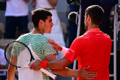 Serbia's Novak Djokovic (R) comforts Spain's Carlos Alcaraz Garfia after his victory during their men's singles semi-final match on day thirteen of the Roland-Garros Open tennis tournament (AFP) Serbia's Novak Djokovic (R) comforts Spain's Carlos Alcaraz Garfia after his victory during their men's singles semi-final match on day thirteen of the Roland-Garros Open tennis tournament (AFP)