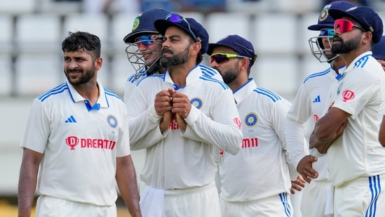 Virat Kohli embraced by Subman Gill as the Indian team watch the review (AP)