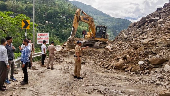 An earthmover being used to clear the debris following a landslide on the Badrinath National Highway near Chhinka, in Chamoli district Uttarakhand. An earthmover being used to clear the debris following a landslide on the Badrinath National Highway near Chhinka, in Chamoli district Uttarakhand.