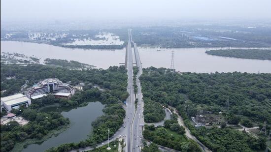Swathes of land are seen inundated with water from the swollen river Yamuna in New Delhi on Saturday. (AP)