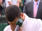 Serbia's Novak Djokovic cries after losing to Spain's Carlos Alcaraz in the men's singles final on day fourteen of the Wimbledon tennis championships