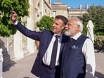 French President Emmanuel Macron and Prime Minister Narendra Modi capturing a selfie in Paris on Friday. (ANI Photo)