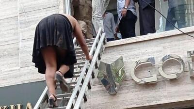 Delhi Fire Services use ladder to bring people out of the building (Twitter/@AtulGargDFS) Delhi Fire Services use ladder to bring people out of the building (Twitter/@AtulGargDFS)