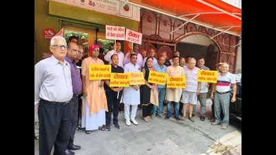 Members of House Owners’ Welfare Association, Sector 9, holding a protest against the opening of a liquor vend in the sector’s inner market in Panchkula on Saturday. (Sant Arora/HT)