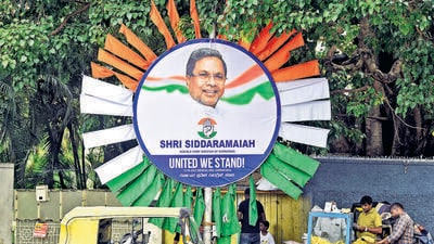 Poster of Karnataka CM Siddaramaiah is put up on the eve of the Opposition meeting in Bengaluru on Sunday. (ANI)