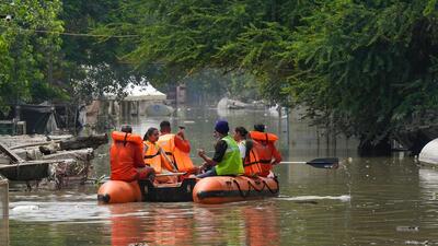 Rescue team members at a waterlogged area in Yamuna Bazar, in New Delhi on Sunday. (PTI) Rescue team members at a waterlogged area in Yamuna Bazar, in New Delhi on Sunday. (PTI)