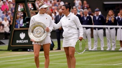 Czech Republic's Marketa Vondrousova celebrates with the trophy alongside runner up Tunisia’s Ons Jabeur after winning the women's final (REUTERS)