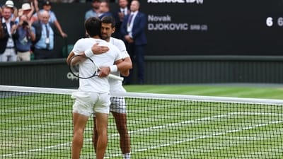 Spain's Carlos Alcaraz with Serbia's Novak Djokovic after winning the final (REUTERS)