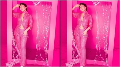 Her stunning outfit boasts a pink shirt embellished with sequin work, featuring a V-neck, collar neckline, and half-folded sleeves. She flawlessly paired it with matching flared pants. (Instagram/@bhumipednekar) Her stunning outfit boasts a pink shirt embellished with sequin work, featuring a V-neck, collar neckline, and half-folded sleeves. She flawlessly paired it with matching flared pants. (Instagram/@bhumipednekar)