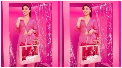 To complete her doll look, Bhumi accessorised her look with a shimmery pink hairband, scarf on the neck, chain necklace featuring her name, pink stud earrings, rings adorning her fingers and a Barbie transparent handbag. (Instagram/@bhumipednekar) To complete her doll look, Bhumi accessorised her look with a shimmery pink hairband, scarf on the neck, chain necklace featuring her name, pink stud earrings, rings adorning her fingers and a Barbie transparent handbag. (Instagram/@bhumipednekar)