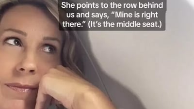 "I said, 'As long as it's a window seat, I'm happy to switch.' She points to the row behind us and says, 'Mine is right there.' (It's a middle seat)," Nelson wrote in her post. (TikTok/@myconquering) "I said, 'As long as it's a window seat, I'm happy to switch.' She points to the row behind us and says, 'Mine is right there.' (It's a middle seat)," Nelson wrote in her post. (TikTok/@myconquering)