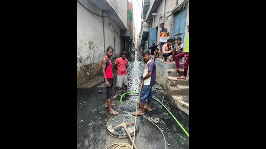 A street filled with sewage in Ludhiana on Saturday. (HT Photo)