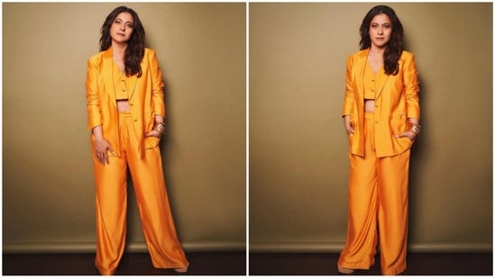 Her pantsuit features satin fabric, and her blazer boasts a double-colored neckline, padded shoulders, and fitted full sleeves. She paired it up with a cropped single-breasted button vest and flared pants.(Instagram/@mohitrai)