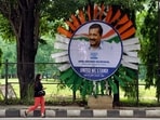 Poster of Delhi Chief Minister Arvind Kejriwal is put up on the eve of the Opposition meeting, in Bengaluru on Sunday. (ANI Photo/Shrikant Singh) 