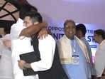 The cheering gesture from the two leaders comes after a bitter war of words on the issue of the ordinance.