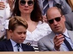 Britain's Prince George and Britain's Prince William, Prince of Wales in the royal box during the men's singles final 