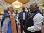 Prime Minister Narendra Modi interacts with Congress president Mallikarjun Kharge. CPI national general secretary D. Raja is also seen.