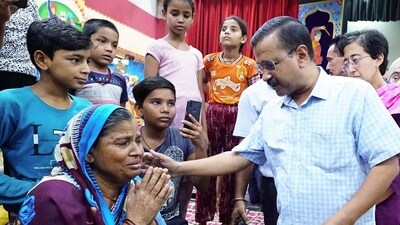 Delhi Chief Minister Arvind Kejriwal accompanied by Delhi Public Works Department Minister Atishi interacts with the flood-affected people during his visit to the relief camp set up at Mori Gate, in New Delhi on Sunday. (AAP Punjab Twitter) Delhi Chief Minister Arvind Kejriwal accompanied by Delhi Public Works Department Minister Atishi interacts with the flood-affected people during his visit to the relief camp set up at Mori Gate, in New Delhi on Sunday. (AAP Punjab Twitter)