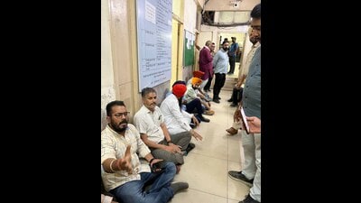 Residents and transporters during a protest outside the office of the Regional Transport Authority (RTA) in Ludhiana on Monday. (HT Photo)