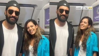 Vicky Kaushal with a fan inside their flight. Vicky Kaushal with a fan inside their flight.