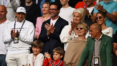 Hugh Jackman and wife Deborra-Lee Furness clap during the Wimbledon's men's singles final in London on Sunday. Spain's Carlos Alcaraz turned out to be the surpise winner against the expected Novak Djokovic.&nbsp; (REUTERS)