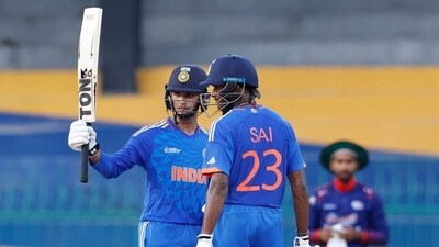 Abhishek Sharma raises his bat after scoring half-century