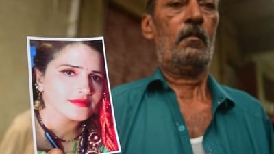 Manzoor Hussain, the landlord of Seema Haider, who left for India to be with her partner Sachin Meena, shows her picture he found in the luggage after she departed in Dhani Bakhsh village in eastern Karachi. (AFP) Manzoor Hussain, the landlord of Seema Haider, who left for India to be with her partner Sachin Meena, shows her picture he found in the luggage after she departed in Dhani Bakhsh village in eastern Karachi. (AFP)