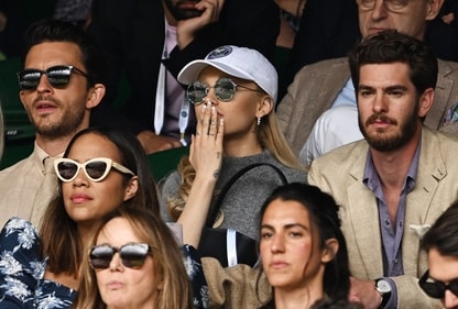 Ariana Grande reacted to certain moments during the match, covering her mouth with her right hand where her ring was notably missing (REUTERS/Dylan Martinez) (REUTERS)