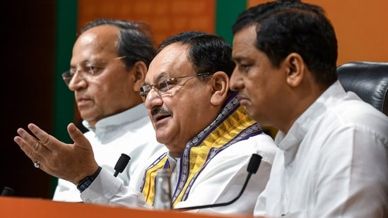 BJP National President JP Nadda along with party MPs Arun Singh and Anil Baluni addresses a press conference, at Party HQ in New Delhi on Monday. (ANI) (HT_PRINT)