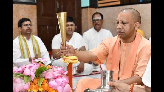 Uttar Pradesh chief minister Yogi Adityanath offering prayers at Gorakhnath temple in Gorakhpur on July 17. (HT photo)