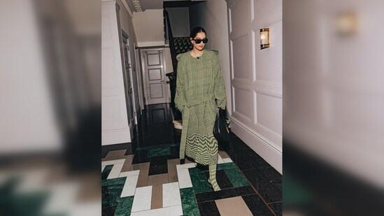Sonam Kapoor kept her look sophisticated in every fashionable sense and paired the dress with black sunglasses, stilettos and a bag, all from Burberry.(Instagram/@theakapoor)