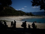 Bathers seek shade on the banks of the receding Sainte-Croix lake, southern France. Human-caused climate change is lengthening droughts in southern France, meaning the reservoirs are increasingly drained to lower levels to maintain the power generation and water supply needed for nearby towns and cities. French tourism, rafting and kayaking in fix as droughts worsen 