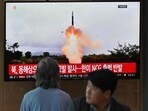 People watch a television screen showing a news broadcast with file footage of a North Korean missile test, at a railway station in Seoul on Wednesday.
