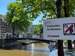 Amsterdam has banned smoking cannabis in public and is imposing fines to get rid of party tourists. Signs around Amsterdam forbid tourists from smoking cannabis. 
