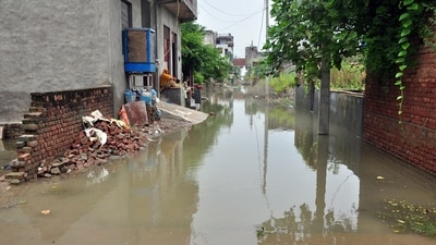 People are forced to remain indoors or to the roof of their houses after water entered their homes in Ghaziabad on Tuesday. (Sakib Ali /HT Photo)