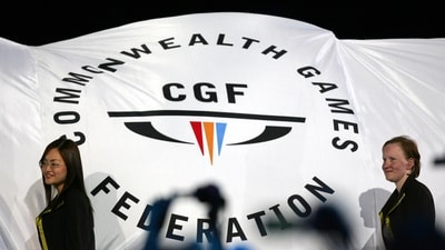 FILE - The Commonwealth Games Federation flag is carried into the arena (AP)
