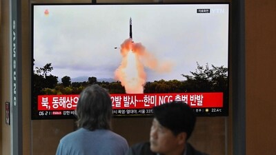 People watch a television screen showing a news broadcast with file footage of a North Korean missile test, at a railway station in Seoul on Wednesday. (AFP)