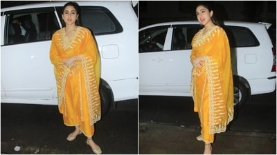 Sara's second look shows her in an orange-coloured organza suit set featuring a lace-embroidered kurta with full-length sleeves, side slits, and a relaxed fitting. She wore it with flared palazzo pants adorned in lace gota patti embroidery on the hem. A matching organza dupatta with similar lace work and scalloped borders rounded it off.&nbsp; (HT PHOTO/Varinder Chawla)