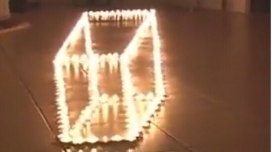 Snapshot of optical illusion made with candles. (Instagram/@Nikola3)