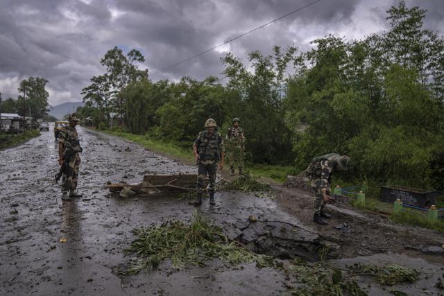 Soldiers inspect the site of a car bomb explosion in Kwakta, some 50 kilometers from Imphal, Manipur, on Manipur, Thursday, June 22, 2023. (AP) Soldiers inspect the site of a car bomb explosion in Kwakta, some 50 kilometers from Imphal, Manipur, on Manipur, Thursday, June 22, 2023. (AP)