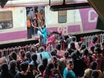 As the local train is running late, there is a rush of commuters at the Thane railway station platform. (Praful Gangurde/ HT Photo)
