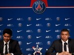 Paris Saint-Germain's CEO Nasser Al-Khelaifi (L) and French forward Kylian Mbappe (R) give a press conference. Paris Saint-Germain's CEO Nasser Al-Khelaifi (L) and French forward Kylian Mbappe (R) give a press conference.