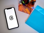 The Threads logo on a smartphone.