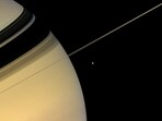 NASA captures Saturn and its moon together. NASA captures Saturn and its moon together.