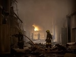 Firefighters work at a site of storage facilities hit during Russian missile and drone strikes, amid Russia's attack on Ukraine, in Odesa, Ukraine July 19, 2023. (Reuters)