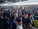 Rush of commuters at Thane railway station as heavy rainfall delayed local trains. (Praful Gangurde/ HT photo)