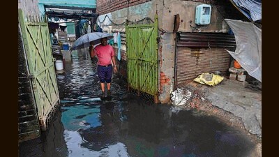 A resident of Sherpur area in Ludhiana removing the sewerage water from his house after the rain. (Gurpreet Singh/HT) A resident of Sherpur area in Ludhiana removing the sewerage water from his house after the rain. (Gurpreet Singh/HT)