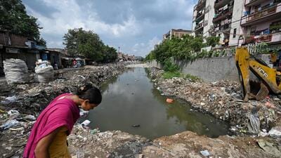 An MCD vehicle cleaning a part of the Taimoor Nagar drain in southeast Delhi on Wednesday. (Sanchit Khanna/ HT Photo) An MCD vehicle cleaning a part of the Taimoor Nagar drain in southeast Delhi on Wednesday. (Sanchit Khanna/ HT Photo)
