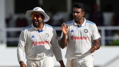Rohit Sharma (L) and Ravichandran Ashwin (R), of India, celebrate the dismissal of Alick Athanaze (AFP) Rohit Sharma (L) and Ravichandran Ashwin (R), of India, celebrate the dismissal of Alick Athanaze (AFP)